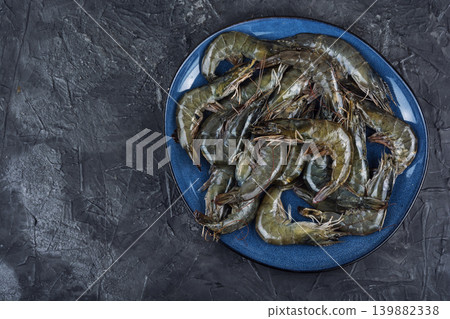 Fresh uncooked langoustines on plates ready for cooking. Fresh uncooked langoustines on plates ready for cooking. 139882338