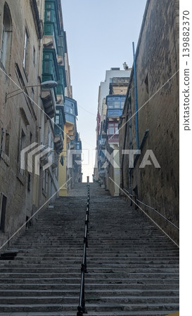 Cityscape of the long stairs of narrow street in the old city 139882370