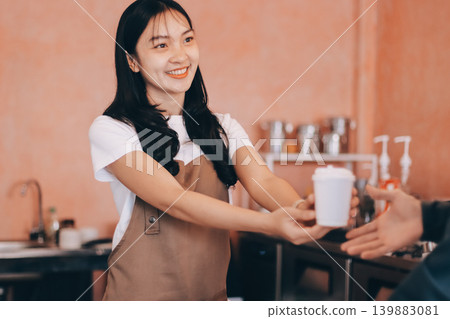 Young woman at barista school learning how to make espresso coffee. Young woman at barista school learning how to make espresso coffee. 139883081