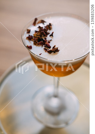 Served drink. Bright beverage. Orange cocktail with foam white top in stemmed glass. Refreshing mix with aroma flavor in restaurant. Served drink. Bright beverage. Orange cocktail with foam white top in stemmed glass. Refreshing mix with aroma flavor in restaurant. 139883206