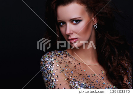 Young woman fashion portrait on dark background Young woman fashion portrait on dark background 139883370