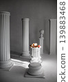 Dramatic studio composition with white columns, flowers, and plaster bust in sunlight 139883468