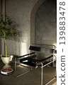 Modern black leather armchair and robot vacuum cleaner in concrete loft interior with olive tree 139883478