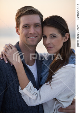 Love, hug and couple on beach with sunset sky for tropical holiday adventure, relax and bonding together. Commitment, happy man and woman on romantic date with ocean, evening and embrace on vacation. Love, hug and couple on beach with sunset sky for tropical holiday adventure, relax and bonding together. Commitment, happy man and woman on romantic date with ocean, evening and embrace on vacation. 139883683