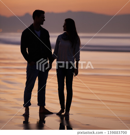Couple, holding hands on beach and sunset, nature and travel with bonding for love and commitment outdoor. People with support, trust and loyalty with adventure together for honeymoon or anniversary Couple, holding hands on beach and sunset, nature and travel with bonding for love and commitment outdoor. People with support, trust and loyalty with adventure together for honeymoon or anniversary 139883700