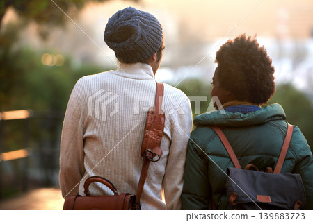 Back view, university student and friends in outdoor on campus, contemplate and relax with backpack in cold weather. College, interracial and classmate for chill, think and plan for assignment. 139883723