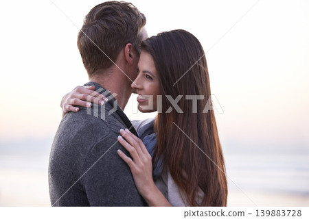 Couple, hug and smile at beach on vacation, love or care with romance in nature, outdoor or ocean. Man, woman and embrace on date, bonding or happy in sunset for memory on holiday by sea in Australia Couple, hug and smile at beach on vacation, love or care with romance in nature, outdoor or ocean. Man, woman and embrace on date, bonding or happy in sunset for memory on holiday by sea in Australia 139883728
