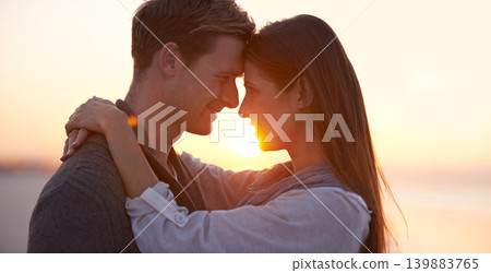 Couple, forehead touch on beach and sunset, nature and travel with bonding for love and commitment outdoor. People with support, trust and hug with adventure together for honeymoon or anniversary Couple, forehead touch on beach and sunset, nature and travel with bonding for love and commitment outdoor. People with support, trust and hug with adventure together for honeymoon or anniversary 139883765