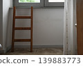 Wooden ladder near window minimal interior soft light shadow composition 139883773