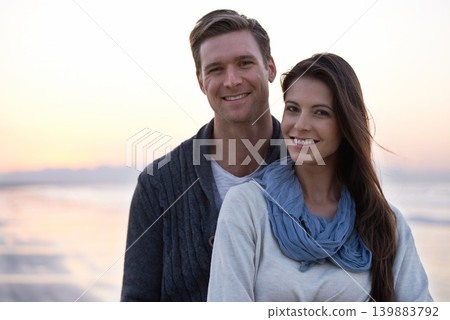 Portrait, love and couple on beach at sunset with happiness together on holiday in Florida. Travel, vacation and man hug woman outdoor on date in summer with care, support and kindness in marriage Portrait, love and couple on beach at sunset with happiness together on holiday in Florida. Travel, vacation and man hug woman outdoor on date in summer with care, support and kindness in marriage 139883792