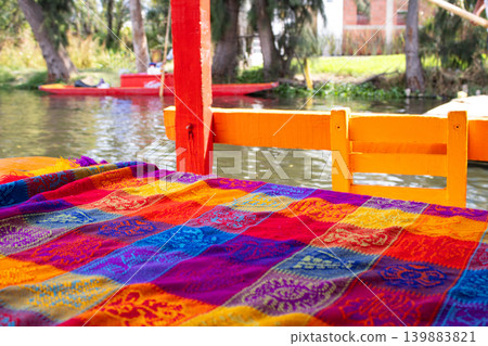 Traditional Mexican table setup on a Trajinera boat in Xochimilco, Mexico City Traditional Mexican table setup on a Trajinera boat in Xochimilco, Mexico City 139883821