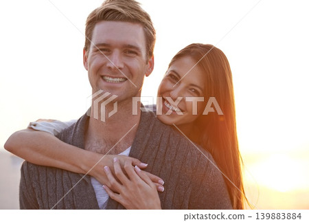 Love, hug and portrait of couple at sunset for tropical holiday adventure, relax and bonding together. Evening, happy man and woman on outdoor date with romance, sky and embrace on vacation in nature Love, hug and portrait of couple at sunset for tropical holiday adventure, relax and bonding together. Evening, happy man and woman on outdoor date with romance, sky and embrace on vacation in nature 139883884