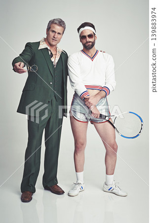 Men, retro and fashion with confidence in studio on white background and smart look with suit and tennis racket. Vintage style and glamour with trends for outfit, elegance and clothes with class Men, retro and fashion with confidence in studio on white background and smart look with suit and tennis racket. Vintage style and glamour with trends for outfit, elegance and clothes with class 139883974