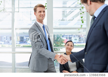 Shaking hands, collaboration and business people in office for agreement, partnership or deal. Smile, meeting and professional men with handshake for onboarding or hiring welcome in workplace. Shaking hands, collaboration and business people in office for agreement, partnership or deal. Smile, meeting and professional men with handshake for onboarding or hiring welcome in workplace. 139883988