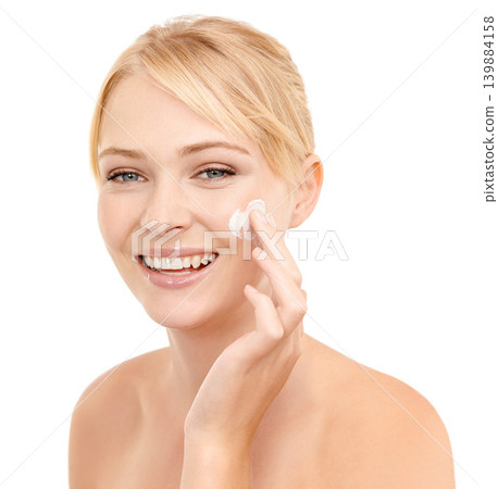 Skincare, face cream and portrait of woman in studio with natural, health and beauty routine. Glow, smile and model with facial spf, sunscreen or lotion for dermatology treatment by white background. Skincare, face cream and portrait of woman in studio with natural, health and beauty routine. Glow, smile and model with facial spf, sunscreen or lotion for dermatology treatment by white background. 139884158