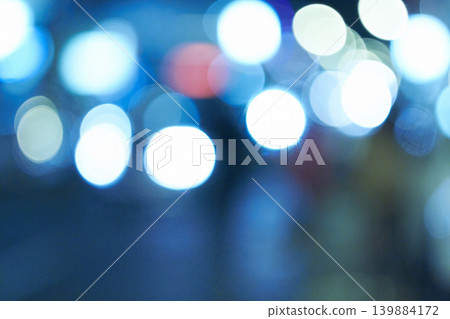 Bright lights, abstract and night with design, city and graphic against a blue background. Creativity, bokeh and blur with aesthetic and shine with colours and effect with pattern, texture and glow Bright lights, abstract and night with design, city and graphic against a blue background. Creativity, bokeh and blur with aesthetic and shine with colours and effect with pattern, texture and glow 139884172