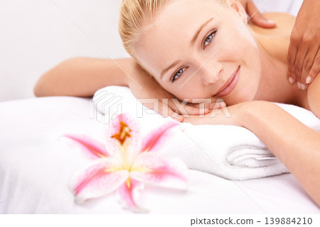 Hands, spa and happy woman portrait on massage table for stress relief body treatment at wellness resort. Zen, luxury and face of lady on vacation at Thailand salon with masseuse healing or therapy Hands, spa and happy woman portrait on massage table for stress relief body treatment at wellness resort. Zen, luxury and face of lady on vacation at Thailand salon with masseuse healing or therapy 139884210
