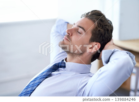 Businessman, moment and relax breathing in office for stress management, relief and balance for peace while working. Man, calm and eyes closed in workplace for wellness break for corporate work Businessman, moment and relax breathing in office for stress management, relief and balance for peace while working. Man, calm and eyes closed in workplace for wellness break for corporate work 139884246