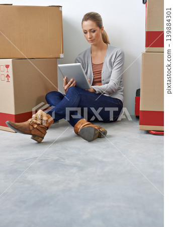 Business, thinking and woman with a tablet, boxes and digital app with typing, decision and startup. Person, employee and entrepreneur with technology or choice with courier or ideas with internet Business, thinking and woman with a tablet, boxes and digital app with typing, decision and startup. Person, employee and entrepreneur with technology or choice with courier or ideas with internet 139884301