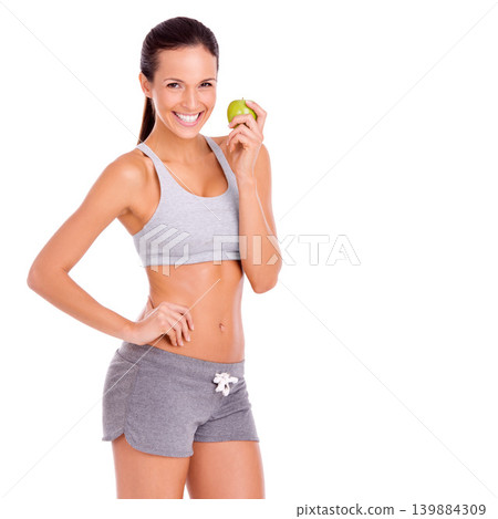 Studio, woman or apple in portrait for fitness with diet, nutrition or weight loss or glow by white background. Spain model, happy face or workout with healthy food for vitamins, fibre or strong body Studio, woman or apple in portrait for fitness with diet, nutrition or weight loss or glow by white background. Spain model, happy face or workout with healthy food for vitamins, fibre or strong body 139884309