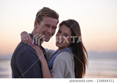 Sunset, hug and portrait of happy couple on beach for tropical holiday adventure, love and bonding together. Evening, happy man and woman on romantic date with ocean, sky and embrace on vacation. Sunset, hug and portrait of happy couple on beach for tropical holiday adventure, love and bonding together. Evening, happy man and woman on romantic date with ocean, sky and embrace on vacation. 139884312