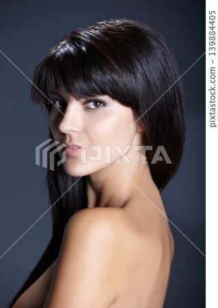Beauty, skincare and portrait of woman with confident skin glow, natural makeup and facial care in studio. Pride, dermatology and luxury cosmetics with face of girl isolated on dark blue background. Beauty, skincare and portrait of woman with confident skin glow, natural makeup and facial care in studio. Pride, dermatology and luxury cosmetics with face of girl isolated on dark blue background. 139884405