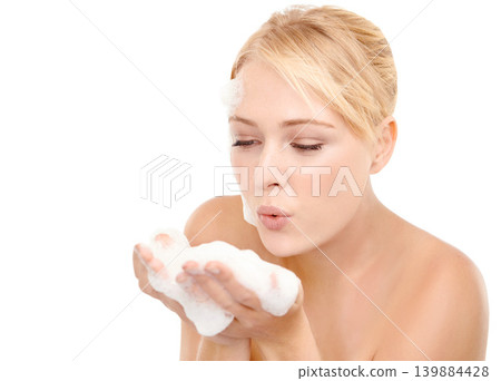 Skincare, foam and woman blowing bubbles in studio for cleaning, cosmetics or wellness on white background. Hands, soap and female model relax with beauty, treatment or facial, wash and application Skincare, foam and woman blowing bubbles in studio for cleaning, cosmetics or wellness on white background. Hands, soap and female model relax with beauty, treatment or facial, wash and application 139884428