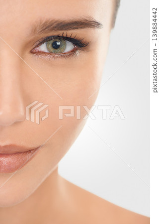 Beauty, portrait and girl for skincare with makeup for natural look, closeup and wellness for self care. Woman, dermatology and cosmetic in studio with mockup, facial and routine for healthy skin Beauty, portrait and girl for skincare with makeup for natural look, closeup and wellness for self care. Woman, dermatology and cosmetic in studio with mockup, facial and routine for healthy skin 139884442