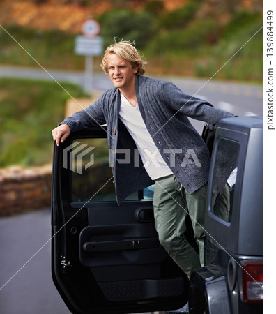Man, car and leaning out door on road trip for travel, break or stop in nature or sightseeing. Young or handsome male person, tourist or traveler exploring or enjoying view or holiday from vehicle Man, car and leaning out door on road trip for travel, break or stop in nature or sightseeing. Young or handsome male person, tourist or traveler exploring or enjoying view or holiday from vehicle 139884499
