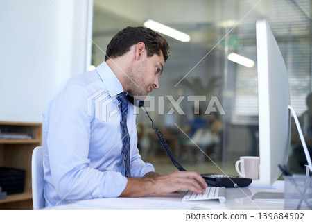 Businessman, phone call and computer for discussion as financial consultant for client loan, investment or accounting. Male person, telephone and typing in New York office, planning or networking Businessman, phone call and computer for discussion as financial consultant for client loan, investment or accounting. Male person, telephone and typing in New York office, planning or networking 139884502