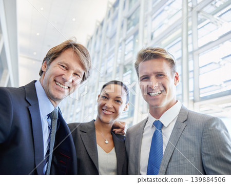 Business people, portrait and confident in office, embrace and pride in partnership or staff. Happy coworkers, teamwork and collaboration or support in workplace, smiling and hugging for solidarity Business people, portrait and confident in office, embrace and pride in partnership or staff. Happy coworkers, teamwork and collaboration or support in workplace, smiling and hugging for solidarity 139884506