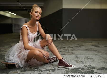 Ballet, fashion and portrait of woman with skateboard for edgy outfit, trendy sneakers and hipster style. Parking lot, modern aesthetic and ballerina on floor for dance hobby, sports or skating skill Ballet, fashion and portrait of woman with skateboard for edgy outfit, trendy sneakers and hipster style. Parking lot, modern aesthetic and ballerina on floor for dance hobby, sports or skating skill 139884539