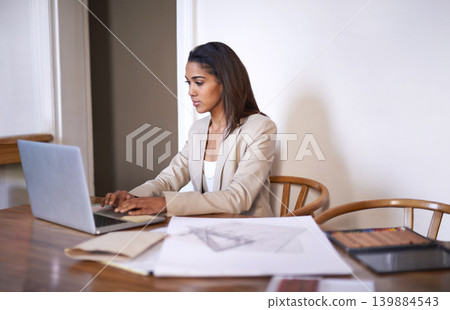 Black woman, desk and typing on laptop for small business, work from home and thinking of idea to design. African female owner, technology and research for architecture, career and entrepreneur Black woman, desk and typing on laptop for small business, work from home and thinking of idea to design. African female owner, technology and research for architecture, career and entrepreneur 139884543