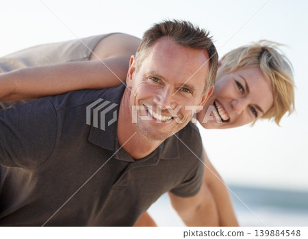 Couple, portrait and smile outdoor with piggyback for bonding, honeymoon date and weekend holiday. Face, man and woman with embrace, happy and love getaway in nature for vacation, travel or adventure 139884548