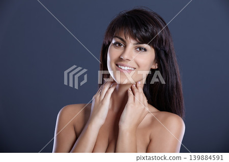 Beauty, skincare and portrait of happy woman with confidence, natural makeup and studio mockup. Smile, dermatology and cosmetics for face of girl with skin glow isolated on dark blue background space Beauty, skincare and portrait of happy woman with confidence, natural makeup and studio mockup. Smile, dermatology and cosmetics for face of girl with skin glow isolated on dark blue background space 139884591