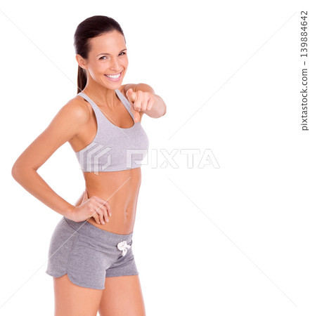 Studio, happy woman and pointing in portrait for fitness promotion and exercise announcement in mockup. Model, face or congratulations to winner of aerobics program or gym offer by white background Studio, happy woman and pointing in portrait for fitness promotion and exercise announcement in mockup. Model, face or congratulations to winner of aerobics program or gym offer by white background 139884642