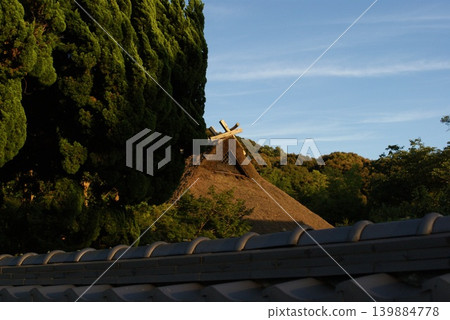 A mountain landscape with thatched-roof houses and trees. A mountain landscape with thatched-roof houses and trees. 139884778