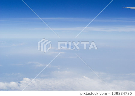 Distant mountain scenery visible through the clouds Distant mountain scenery visible through the clouds 139884780