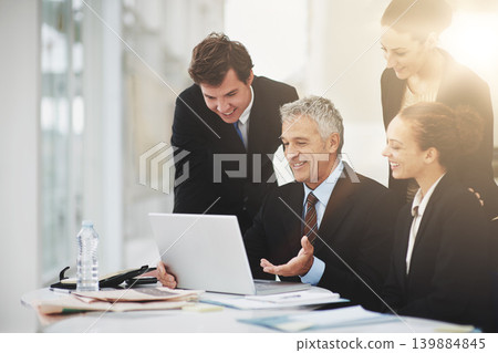 Employees, discussion and CEO with laptop in office, smile and technology on desk for planning. Colleagues, happy and talking to boss of workplace in corporate company for strategy and business Employees, discussion and CEO with laptop in office, smile and technology on desk for planning. Colleagues, happy and talking to boss of workplace in corporate company for strategy and business 139884845