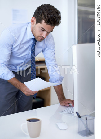 Businessman, computer and paperwork in office for online research for feedback review, planning or brainstorming. Male person, document and financial consultant for budget, accounting or investing Businessman, computer and paperwork in office for online research for feedback review, planning or brainstorming. Male person, document and financial consultant for budget, accounting or investing 139884860