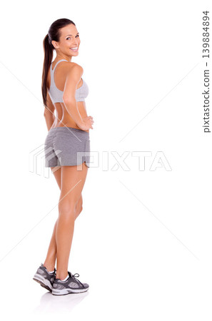 Studio, model and happy in portrait for exercise in gym clothes, training and weight loss by white background. Confident woman, face or strong body of aerobics workout, glow or commitment to fitness Studio, model and happy in portrait for exercise in gym clothes, training and weight loss by white background. Confident woman, face or strong body of aerobics workout, glow or commitment to fitness 139884894