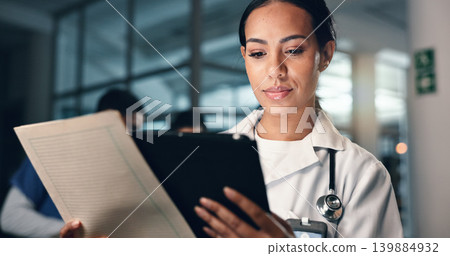 Doctor, woman and tablet with document, night and analysis for results, decision and info in hospital. Medic, digital touchscreen and paperwork for health, history and planning for thinking in clinic 139884932