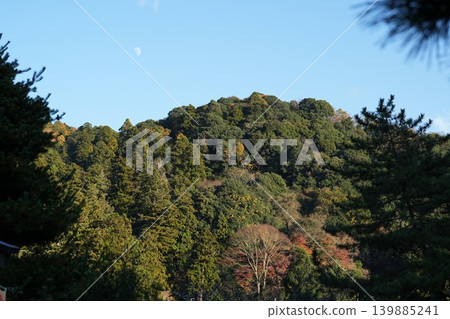 Autumn leaves and the moon at Hase-dera Temple, the head temple of the Nara Yamato region, famous for its flowers. Autumn leaves and the moon at Hase-dera Temple, the head temple of the Nara Yamato region, famous for its flowers. 139885241