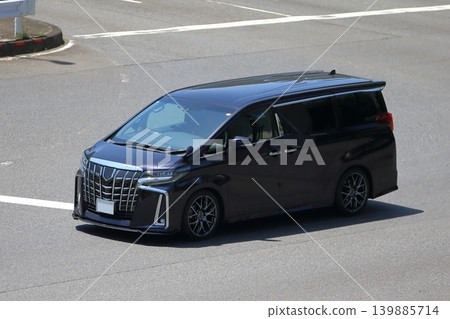 A black luxury minivan in motion A black luxury minivan in motion 139885714