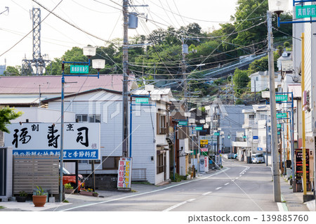 [Manazuru Station] The quiet shopping street in front of the station in the early morning. 139885760
