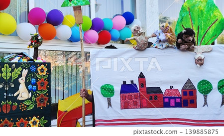 Preschool children and teacher creating a large scale paper map project, educational teamwork, classroom learning. Preschool children and teacher creating a large scale paper map project, educational teamwork, classroom learning. 139885875