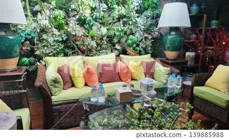 This is a living room with a sofa and garden This is a living room with a sofa and garden 139885988