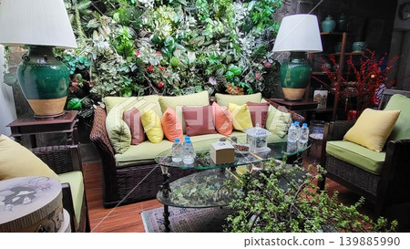 This is a living room with a sofa and garden 139885990