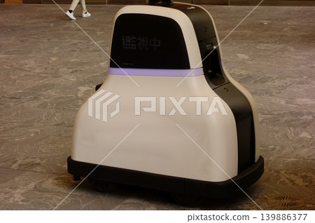 Inside a building where robots are patrolling. 139886377