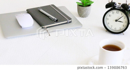 An image of desk work, with the laptop closed for a break. An image of desk work, with the laptop closed for a break. 139886763